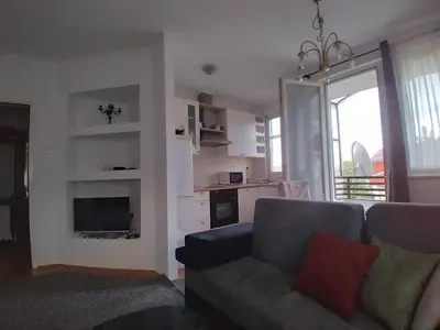 a living room with a couch and a tv at Apartman CENTAR in Banja Luka