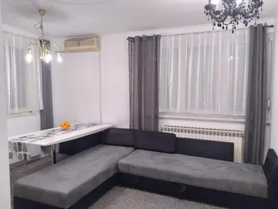 a living room with a couch and a table at Apartman CENTAR in Banja Luka