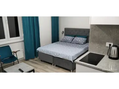 a small bedroom with a bed and a kitchen at Slatka Tajna in Banja Luka