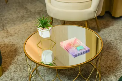 a glass table with a potted plant on top of it at Hotel City View in Prnjavor