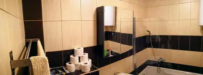 a bathroom with a glass shower and a sink at Apartman HANA in Travnik