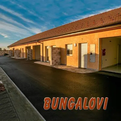a building on the side of a street at Motel Atos Bungalovi in Nova Topola