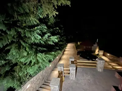 a row of benches in a park at night at Apartmani Megara Vlasic in Šišava