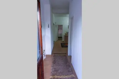 an open hallway with a hallway leading to a room at apartment HOME in Bihać