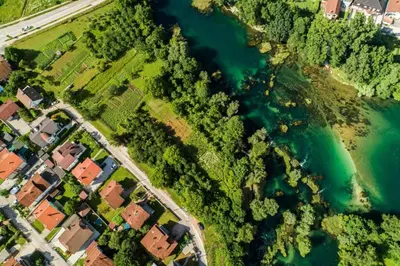 an aerial view of houses and a river at apartment HOME in Bihać