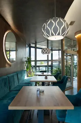 a living room with a couch and a table at Hotel Grand in Banja Luka