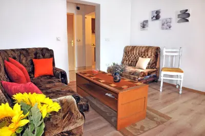a living room with two couches and a coffee table at Hostel Room in Banja Luka