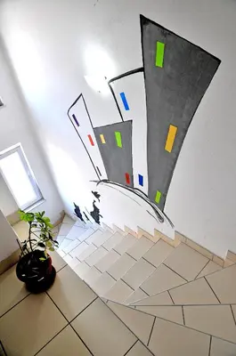 a room with a wall with a drawing on the wall at Hostel Room in Banja Luka