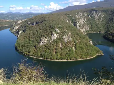 an island in the middle of a body of water at Hostel Room in Banja Luka
