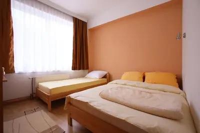 a bedroom with two beds and a window at Motel Maks in Kiseljak