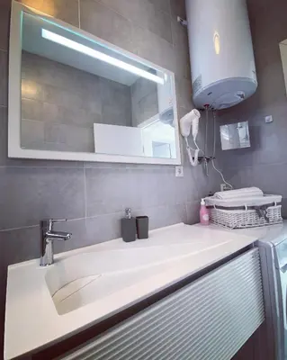 a bathroom with a sink and a mirror at River Luxury House in Bihać