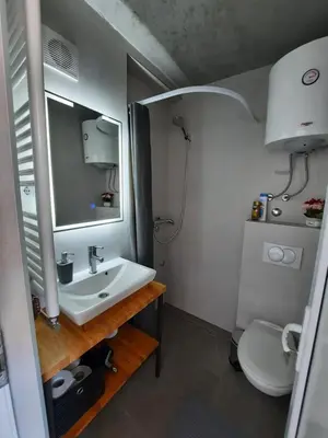 a bathroom with a sink and a toilet at Apartman Tvrdjava in Banja Luka