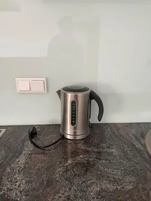 a coffee pot is sitting on a counter at Oaza in Jelah