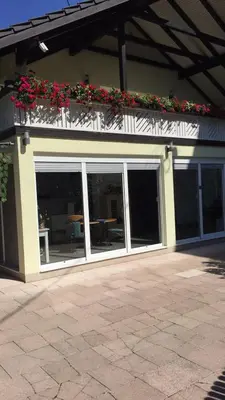 a building with a window with flowers on it at Oaza in Jelah