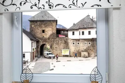 a window with a view of a castle at apartman UNO in Jajce