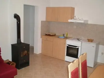 a kitchen with a stove and a stove top oven at Apartments Marevic in Kupres