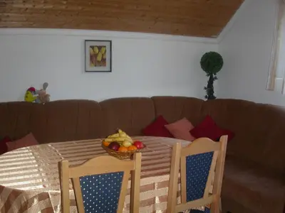 a table with a bowl of fruit on top of a couch at Apartments Marevic in Kupres