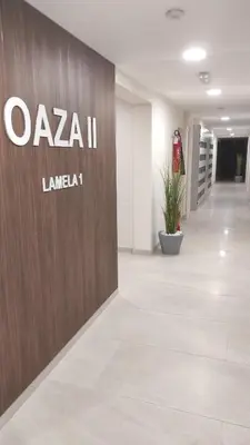 an office lobby with a sign on a wall at M&I Apartment in Doboj