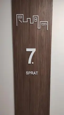 a wooden door with the number seven on it at M&I Apartment in Doboj