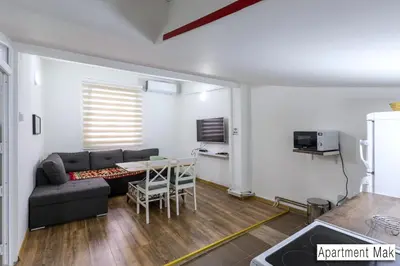 a living room with a couch and a table at Pansion Beg in Tuzla