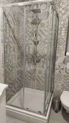 a shower stall in a bathroom with a toilet at Apartman Green Lux in Banja Luka