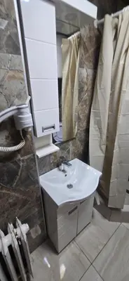 a bathroom with a sink and a mirror at Apartment City Centar in Banja Luka