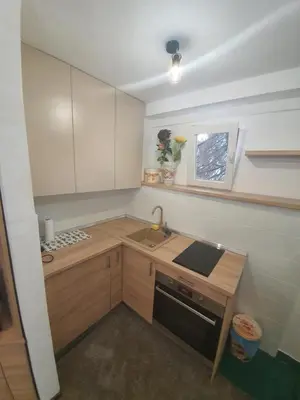 a small kitchen with a sink and a stove at Apartment City Centar in Banja Luka