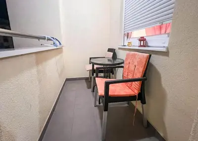a small table and chairs in a small room at Apartman Royal 2 in Doboj