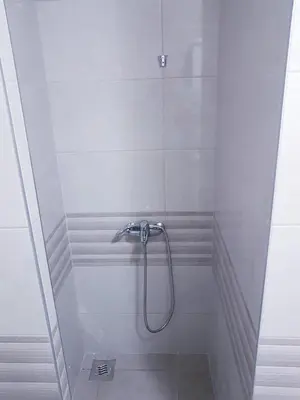 a shower with a faucet in a bathroom at Apartman Istra, Doboj in Doboj