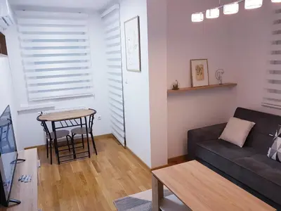 a living room with a couch and a table at Apartman Istra, Doboj in Doboj