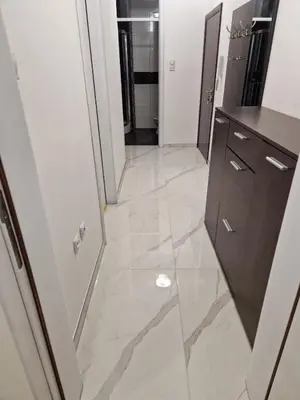 a hallway of a room with a tile floor at Apartman Casa Banja Luka in Banja Luka