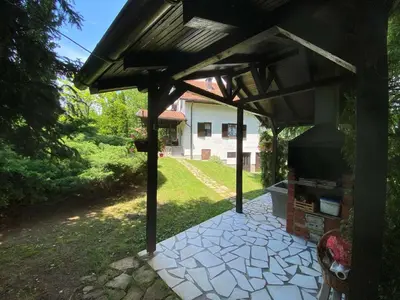 a pergola with a grill in a yard at PURE NATURE in Visoko