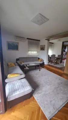 a living room with a couch and a table at Villa Behić in Bihać