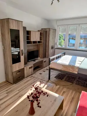 a bedroom with a bed and a tv in it at Apartman Banja Luka 2 in Banja Luka