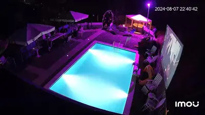 an overhead view of a swimming pool at night at Apartment STONE in Visoko