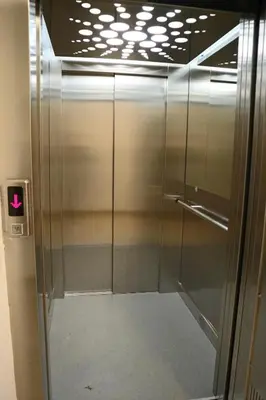 a elevator in a building with a glass door at Apartman Lilly in Modriča