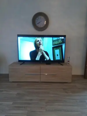a flat screen tv sitting on top of a dresser at apartman Vidović in Livno