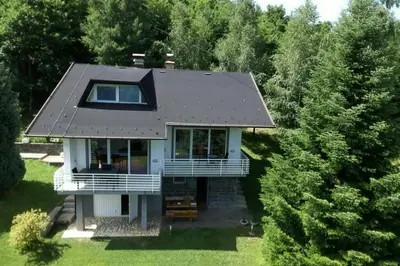 an aerial view of a house with a roof at WOLF'S PLANE Luxury Isolated Mountain House for Digital Nomads in Fojnica