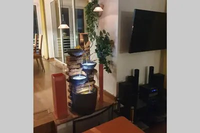 a living room with a group of potted plants at WOLF'S PLANE Luxury Isolated Mountain House for Digital Nomads in Fojnica