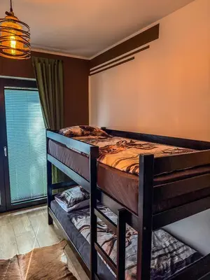 a bedroom with a bunk bed in a room at Vila Bašić Vlašić Spa Apartman JELEN in Vlasic