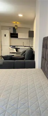 a living room with two couches and a piano at Apartman CITY CENTER 3-šetalište in Prijedor