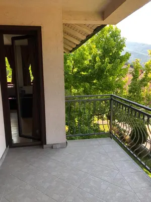 an open door to a balcony with a view at Sound apartment in Fojnica