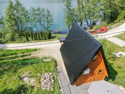 an overhead view of a small house with a black roof at Malena Plivsko Jezero Jajce in Jajce