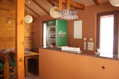 a bar in a restaurant with a drink machine at Sherwood resort in Bihać