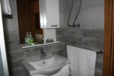 a bathroom with a sink and a towel at Sherwood resort in Bihać