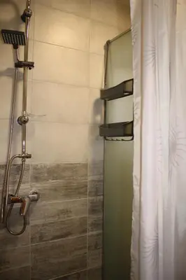 a bathroom with a shower with a glass door at Sherwood resort in Bihać