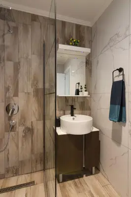 a bathroom with a sink and a shower at Deluxe Feliciano Apartments in Visoko