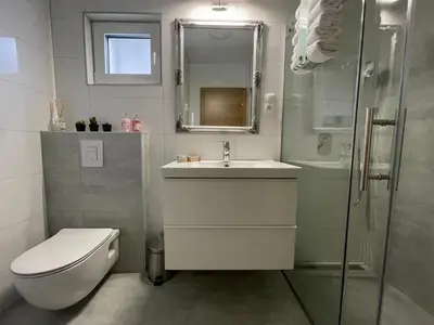 a bathroom with a toilet and a sink and a shower at Una Verde in Bihać