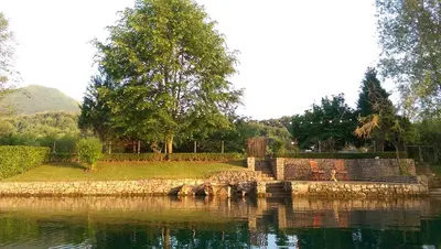 a small island in the middle of a body of water at Una Verde in Bihać