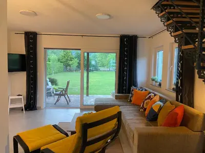 a living room with a couch and a table at Una Verde in Bihać